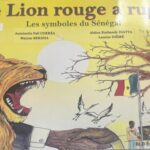 LE LION ROUGE A RUGI